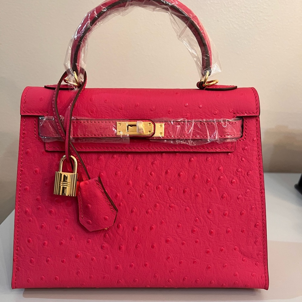 Ostrich embossed Genuine Leather 25cm handbag with Gold Hardware.